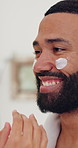 Hands, person and lotion on man for skincare, beauty cosmetics and facial treatment in bathroom. Smile, couple and cream with sunscreen protection, apply moisturizer and dermatology benefits at house