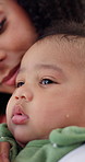 Woman, comfort baby and care with crying in home, support and love in nursery for routine. Mother, infant and connection in morning with embrace, sad and moody with single parent at family house
