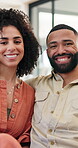 Face, couple and bonding in living room, chilling or hug in home, romance or affection in apartment. Happy, man and woman in house, together and love in lounge on break, relax and embrace on weekend