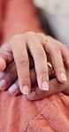 Couple, hands and marriage with ring for commitment, loyalty or vow together in home. Closeup, man and woman with touch, finger jewelry or trust for romantic partnership, love or support in house