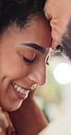 Happy couple, forehead and love with embrace for commitment, romance or bonding in home. Man, woman or lovers with smile, trust or touch for compassion, trust or support together in comfort or house
