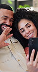 Happy couple, wave and video call with phone for online meeting or communication in home. Man, woman or talking with smile on mobile smartphone for virtual chat, discussion or network app in house