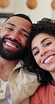 Face, couple and bonding in home, hug or chilling in living room, romance or affection in apartment. Happy, man and woman in house, together and love in lounge on break, relax and embrace on weekend