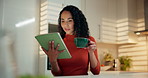Woman, coffee and reading with tablet in kitchen for research, online connection or network in home. Female person, freelancer and drinking caffeine with cup on technology for news or ebook in house