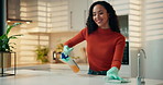 Happy woman, dancing and cleaning with spray in kitchen for hygiene or disinfection in home. Female person, housewife and wiping surface with cloth or gloves for housekeeping or chores in house