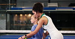 Woman, teaching and helping child for padel lesson, instructions and demonstration on court. Coach, explain and kid with racket guidance for technique, sports tips and learning skills of fitness game