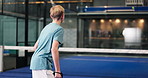 Practice, coach and child with padel on court for training, shot selection or technique development. Back, instructor or people at indoor club for junior coaching, game strategy or sports performance