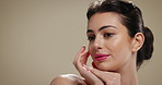 Thinking, woman and beauty for skincare in studio background for healthy skin, texture and hydration. Female person, ideas and satisfaction for facial glow, treatment results and dermatology benefits