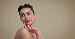 Skincare, mockup space and woman in studio for thinking of natural, glow or facial dermatology. Cosmetics, makeup and person with confidence for face cosmetology with beauty by brown background.