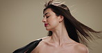 Beauty, hair care and hairdryer with woman in studio for salon treatment, volume and growth. Shine, shampoo and hairdresser tools with person on background for aesthetic, cosmetics and keratin glow