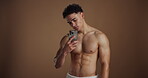 Influencer, man and shirtless for selfie in studio background, social media post and fitness results. Male person, topless or profile picture update, muscle growth and body transformation of grooming