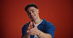 Face, happy man or clapping for congratulations in studio for goal achievement, winning or success. Smile, portrait or applause on red background with prize space for support, encouragement or award