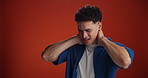 Studio, neck injury and man with pain, muscle tension or massage with inflammation on red background. Spine problem, arthritis and person with sore joint, health risk and fibromyalgia with space