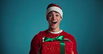 Face, surprise and man with gift on Christmas for giving present, celebration and studio background. Portrait, male person and dance with package, win giveaway and box for xmas competition on holiday