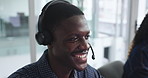 Contact center, smile and man talking for help, tech support or coworking with feedback for software. Callcenter, headset and agent consulting for IT assistance, troubleshooting or customer service
