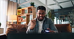 Man, video game and controller on couch for fist pump, challenge and esports goals in living room. Person, gamer and winner on sofa with console, television and celebration for next level at home