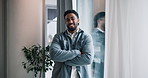 Crossed arms, happy and face of businessman in office with confidence for creative career. Smile, laughing and portrait of male copywriter from India with pride by window for job in workplace.