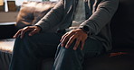 Nervous, hands and man with anxiety at therapy for PTSD, trauma counseling and stimming with panic. Psychology, mental health and patient in clinic with fidgeting, worry and contemplating appointment
