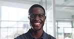 Smile, face and black man in office for business as insurance agent with ambition for career. Portrait, happy worker and confident employee, African professional and risk consultant with glasses