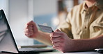Laptop, credit card and hands of man with online shopping, celebration or bonus reward on app in home. Debit, computer and male person with fist pump for paying bills with website banking in house.