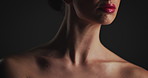 Woman, beauty and skincare with shoulders in studio, lipstick and natural glow on background. Person, model and neck with wellness, results and cosmetics with makeup, transformation and dermatology