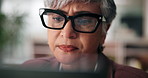 Computer, glasses and businesswoman in office with research for finance budget proposal. Reading, technology and mature female financial manager working on investment report for client in workplace.