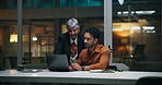 Business people, discussion and planning with laptop at night for budget report, finance or update. Office, financial analyst and manager for investment pitch review, proposal feedback and teamwork