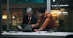 Business people, night or laptop with documents for finance, budget planning or project in office. Businessman, woman or employees working late with computer, paperwork or report for company deadline