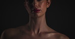 Aesthetic, skincare and cosmetic with woman in studio on dark background for shadow, art or cosmetology. Beauty, dermatology and lighting for serious model in shade for change, transformation or glow