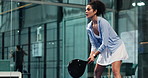 Athlete, woman and playing padel on court for match practice, game challenge or serving ball. Fitness, player and ready with racket at indoor club for technique training, sports performance or skills