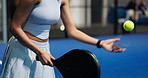 Hands, person and serve with racket for padel games, sports training and practice for competition. Athlete, woman and gear with ball for contest performance, match preparation and fitness tournament