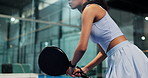 Hands, woman and playing padel on court for game practice, fitness training and serving ball. Sports, tennis player and swing with racket at indoor club for technique exercise, performance and skills