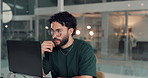 Man, thinking and laptop with typing at office, project management and content creation at media company. Person, computer and decision for editing process, review and feedback at creative agency