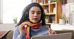 Woman, freelancer or video call with laptop on sofa for discussion, conversation or chat in home. Female person, remote work or talking with headset or mic for virtual meeting, online help or advice