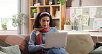 Creative, woman and typing with laptop on sofa for blog editing, fast checking info or remote work. Freelancer, writer and proofreading with tech in home for source verification, article and research