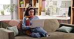 Remote work, woman and typing with laptop on sofa for proofreading draft, article editing and blog. Freelancer, writer and thinking with tech in home for source verification, news story and research