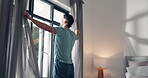 Curtains, wake up and thinking with man in bedroom for morning routine, relax and reflection. Start of day, perspective and wellness with person and window of home for peace, sunrise and inspiration