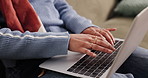 Hands, woman and typing with laptop on sofa for proofreading draft, remote work and blog editing. Freelancer, writer and tech in home for writing news story, article research and creative development