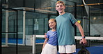 Face, children and smile for padel tennis on court with hug, sports training and sibling support. Portrait, kids and family embrace of match practice, team preparation and competition at fitness club