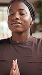 Breathe, black woman and prayer hands with yoga in home for health, wellness and aura in living room. Pilates, holistic meditation and female person in lounge for spiritual practice and zen or chakra