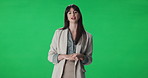 Talking, woman and journalist by green screen for broadcast, live streaming or announcement. TV network, presenter and portrait of female news reporter with media update or speech by chroma key.