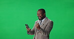 Achievement, black man and employee with smartphone, green screen or communication with tech on web. Studio, excited and mature person with mobile, mockup space or celebration for success or laughing