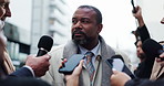 Politician, man and speaking with journalist for interview, government policy or broadcast. News, politics or talk to reporter for press conference, question or announcement with minister in city