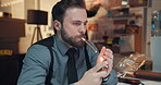 Man, detective and smoking cigarette in office for investigation, problem solving and crime case. Thinking, male person and reflection for clues, suspect motive and justice ideas for mapping evidence