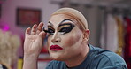 Eyelash, makeup and backstage with drag performer in studio for beauty, lgbt culture and cosmetics. Pride, extension application and identity with person in dressing room for makeover and artist