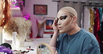 Powder, makeup and backstage with drag performer in studio for blush, lgbt culture and cosmetics. Foundation application, beauty products and queer theater with person in dressing room as artist