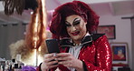 Drag artist, online and laughing with phone, dressing room or browsing comments on social media app. Reading, positive reviews and connection with fans on website, performer and person with mobile