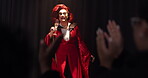 Applause, champagne and stage with drag performer in theater for lgbt culture, nightlife and spotlight show. Queer identity, entertainment and winner with person at event for celebration and pride
