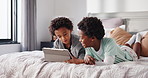 Brothers, children or watching with tablet in bed for online entertainment or games in home. Black kids, boys or happy siblings lying with technology for subscription or network connection in bedroom