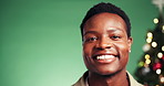 Face, black man and smile on Christmas in studio for gift ideas, celebrate holiday and tradition. Thinking, male person and mockup space at party, xmas season and present decision on green background